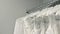 Wedding dresses hanging on a hanger. Fashion look. Interior of bridal salon.