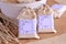 Wedding favours nautical beach party guest gifts in cream colour cotton bags with anchor blue pattern decoration