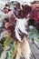 Wedding floral composition with vinous anthuriums, cortaderia, hydrangea, roses, eucalyptus.