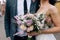 Wedding floristics, the bouquet holds the bride in hand