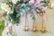 Wedding floristry. Decoration of the celebration with flowers. Golden hanging candlesticks, the cheering of the table of