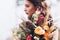 Wedding floristry in a yellow autumn meadow in the hands of a girl dressed in the style of boho.