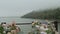 Wedding flower arch and decoration lake and mountains in fog on the background, close - up wedding arch with pink