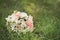 wedding flower bouquet on green grass