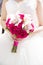 Wedding flower bouquet with pink roses and white callas