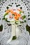 Wedding flower bouquet on a white garden chair