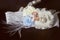 Wedding garter for bride with lace and feather