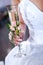 Wedding glass in hands of bride