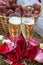 Wedding glasses of champagne on background basket with grapes