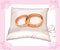 Wedding gold rings on satin pillow