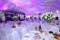 Wedding hall without guests with white chairs and decor in the outdoor wedding tent