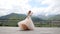 Wedding. Happy red-haired bride dancing against the background of mountains