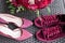 Wedding Heels VS bridal sneakers. Red wedding bridal accessories: bridal heels and sneakers of marsala color, red bridal bouquet f