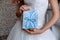 Wedding invitation blue card in hands