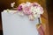 Wedding invitation plate decorated with fresh astilbe, carnation, delphinium, ornithogalum, authurium and hydrangea flower. Title