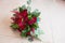Wedding. Lush bridal Bouquet of red roses and a lot of greenery