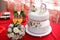 Wedding mastic cake decorated with flowers and cat figures, closeup