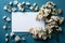 Wedding mockup with white paper list and flowers gypsophila on blue table