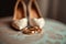 Wedding morning details gold rings, brides shoes, engagement essentials