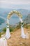 A wedding in the mountains. Wedding arch for the ceremony on the