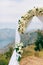 A wedding in the mountains. Wedding arch for the ceremony on the