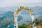 A wedding in the mountains. Wedding arch for the ceremony on the