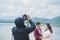 Wedding photographer in action, Wedding photography takes pictures of the bride and groom in nature. Behind the scene of