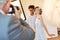 Wedding photographer takes picture of happy bridal couple