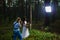 Wedding photographer using strobe and softbox to make close-up portraits