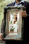 Wedding picture, elegant bride throw antique mirror