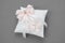 Wedding Pillow for Rings decorated with pink ribbons.