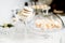 Wedding reception dessert table with delicious decorated white c