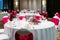 Wedding reception dinner table, white and red theme chairs