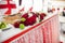 Wedding reception table closeup of red freshly cut roses decoration