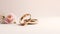 Wedding ring ads background. Wedding rings from red gold on light background, copy space. Gold wedding rings. Minimalistic rings