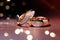 Wedding rings on bokeh background, close-up, Designer wedding rings on a sparkling background, AI Generated