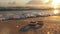 wedding rings gleaming on a sandy beach under radiant backlight, evoking the eternal bond between partners.