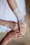 Wedding rings on hands of bride, mother and grandmother