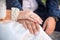 Wedding rings on the hands of the groom and the bride