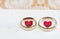 Wedding rings and red hearts of a Polish married couple