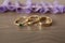 Wedding rings on wooden background. Garter of the bride.