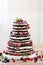 Wedding rustic naked cake with fruits on wooden background