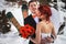 Wedding snowboarders couple just married at mountain winter