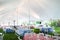 Wedding or special event tables set up for an outdoor barbeque with red and blue checkered table clothes under an event tent