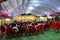 Wedding stage for jai mala prograamme with green carpet red chair and white coulor roof silver front,