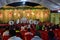 Wedding stage for jai mala prograamme with green carpet red chair and white coulor roof silver front,