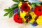 A wedding story or background Mother`s Day. Basket bouquet of gerbera and chrysanthemums on a stone background