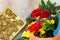 A wedding story or background Mother`s Day. Basket bouquet of gerbera with chrysanthemums and sweets