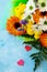 A wedding story or background Mother`s Day. Bouquet of gerbera with chrysanthemums and present