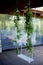 Wedding swing decorated with flowers hanging on the branches of the willow